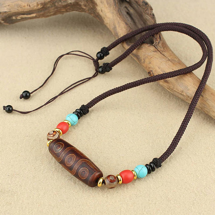 Buddha Stones Collar colgante de abalorio Dzi tibetano de nueve ojos de Dzi de tres ojos cuerda protectora