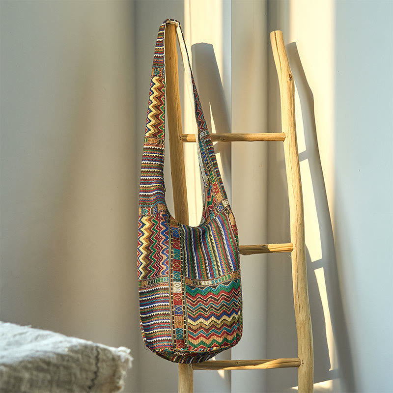 Bolso bandolera de algodón con patrón de ondas verdes y marrones de Buddha Stones