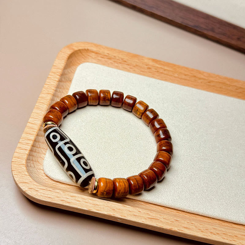 Pulsera protectora de cuentas dzi de nueve ojos con cuentas de hueso tibetano de Buddha Stones