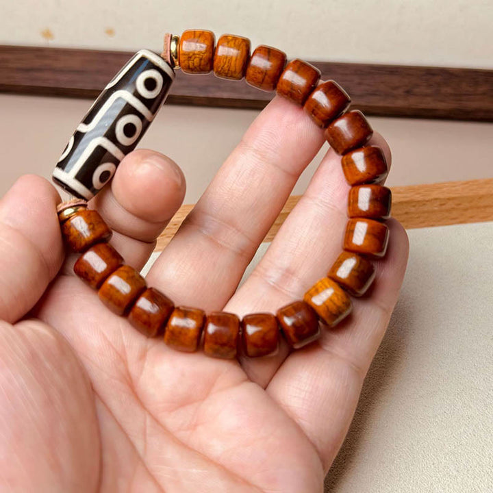 Pulsera protectora de cuentas dzi de nueve ojos con cuentas de hueso tibetano de Buddha Stones