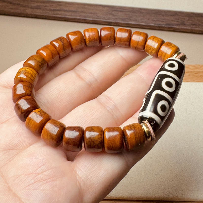 Pulsera protectora de cuentas dzi de nueve ojos con cuentas de hueso tibetano de Buddha Stones