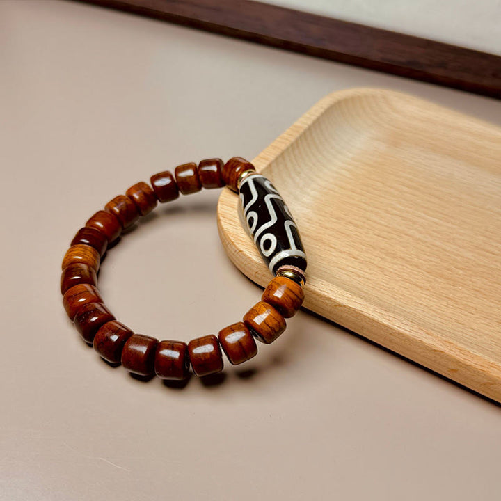 Pulsera protectora de cuentas dzi de nueve ojos con cuentas de hueso tibetano de Buddha Stones