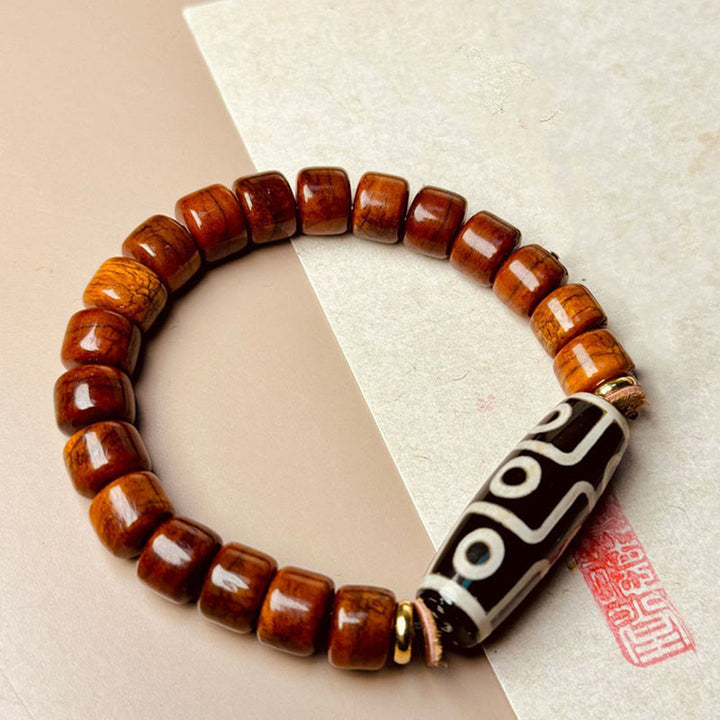 Pulsera protectora de cuentas dzi de nueve ojos con cuentas de hueso tibetano de Buddha Stones