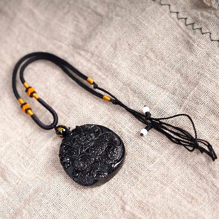 Buddha Stones Colgante de protección de obsidiana negra natural redonda con dragón tallado