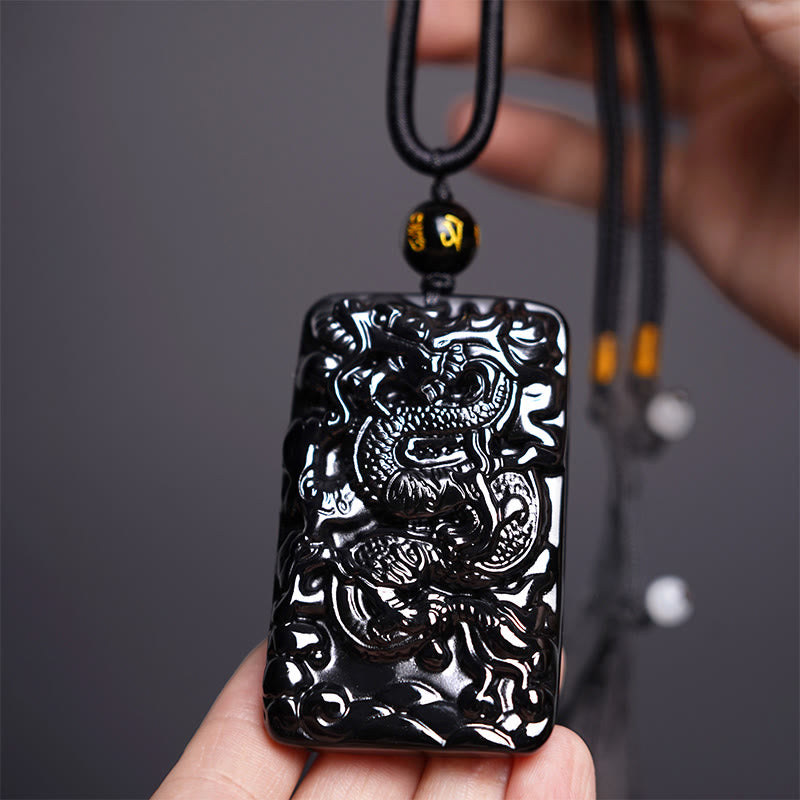 Buddha Stones Colgante de Éxito Rectangular con Dragón Grabado Natural de Obsidiana Negra - Dragón 62 mm x 39 mm - image 1