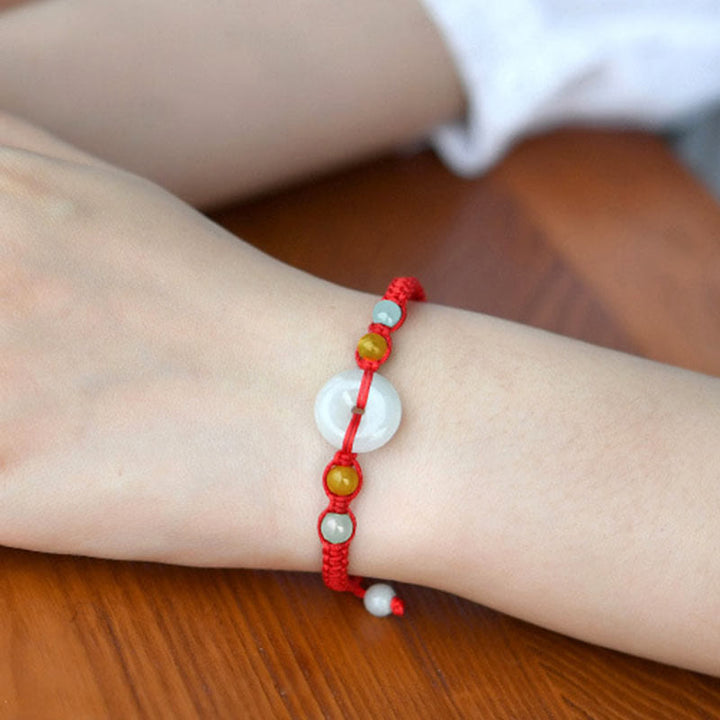 Pulsera de cuerda roja de la suerte con jade y broche de paz de Buddha Stones