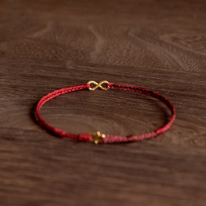 Pulsera de cuerda de la suerte hecha a mano con nudo infinito y Buddha Stones en oro 999