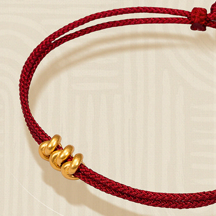 Pulsera trenzada de cuerda con diseño de nudo de los deseos hecha a mano con Buddha Stones en oro 999