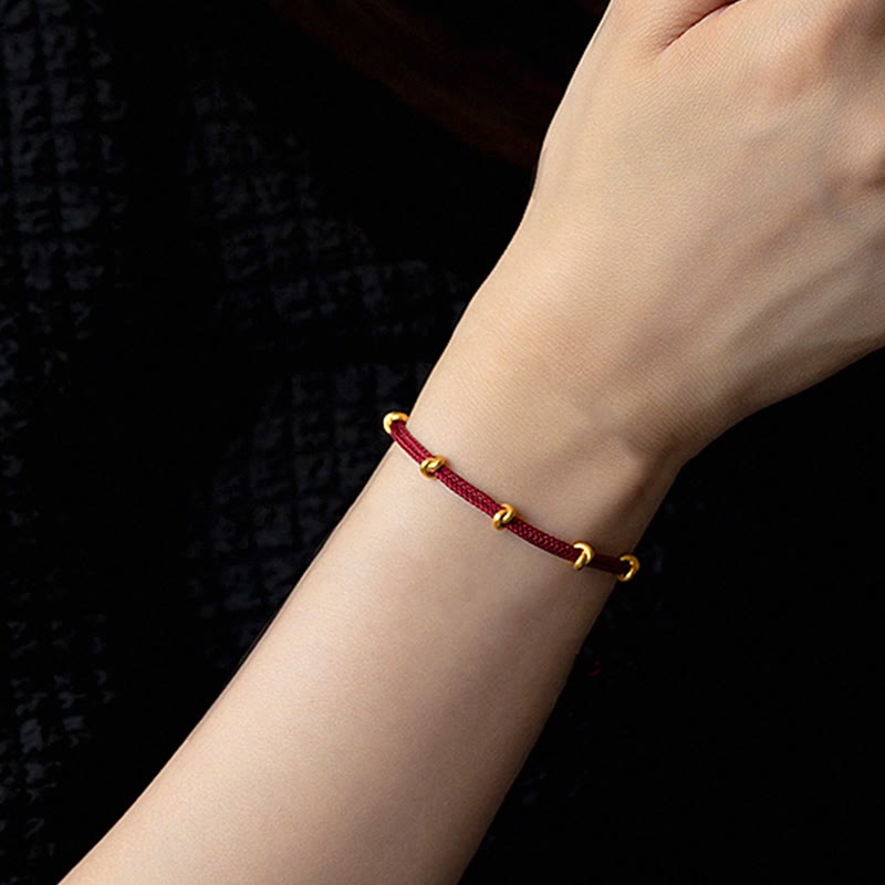Pulsera trenzada de cuerda con diseño de nudo de los deseos hecha a mano con Buddha Stones en oro 999