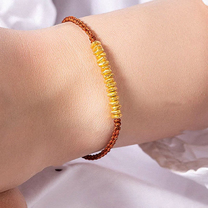 Pulsera trenzada de protección hecha a mano con diseño de pequeñas piezas de oro 999 y Buddha Stones