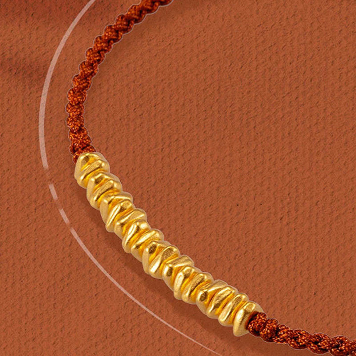 Pulsera trenzada de protección hecha a mano con diseño de pequeñas piezas de oro 999 y Buddha Stones