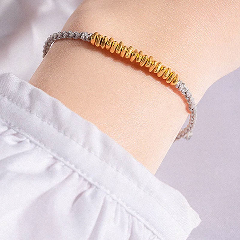 Pulsera trenzada de protección hecha a mano con diseño de pequeñas piezas de oro 999 y Buddha Stones