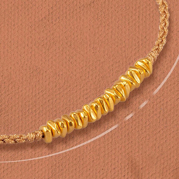 Pulsera trenzada de protección hecha a mano con diseño de pequeñas piezas de oro 999 y Buddha Stones