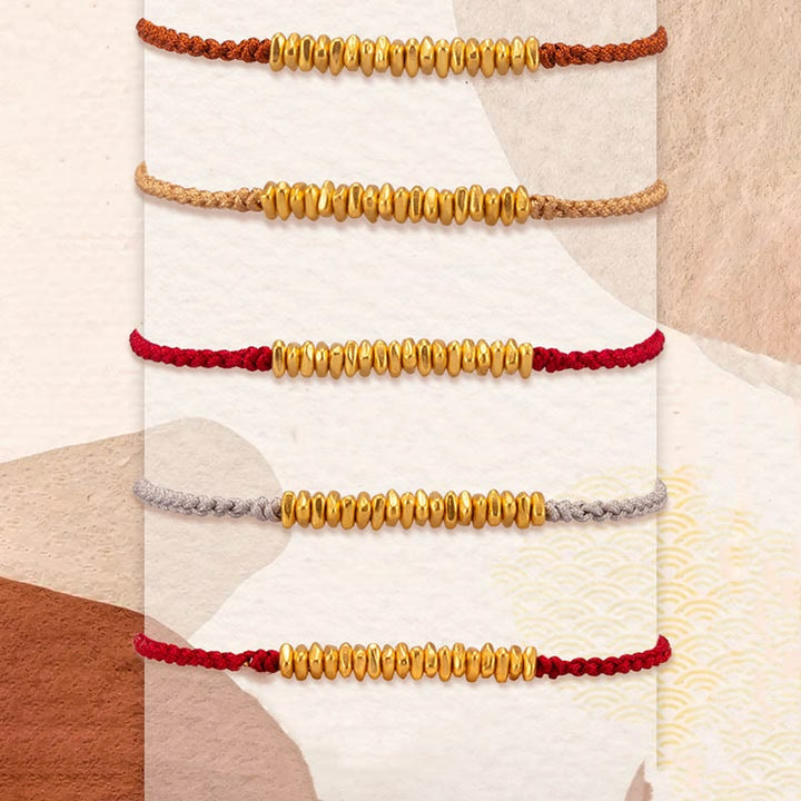 Pulsera trenzada de protección hecha a mano con diseño de pequeñas piezas de oro 999 y Buddha Stones