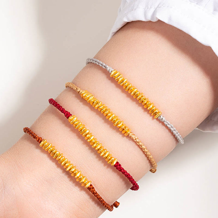 Pulsera trenzada de protección hecha a mano con diseño de pequeñas piezas de oro 999 y Buddha Stones