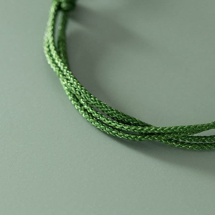 Pulsera trenzada de cuerda verde con mango de Ruyi y símbolo de la suerte hecha a mano con Buddha Stones en plata de ley 999