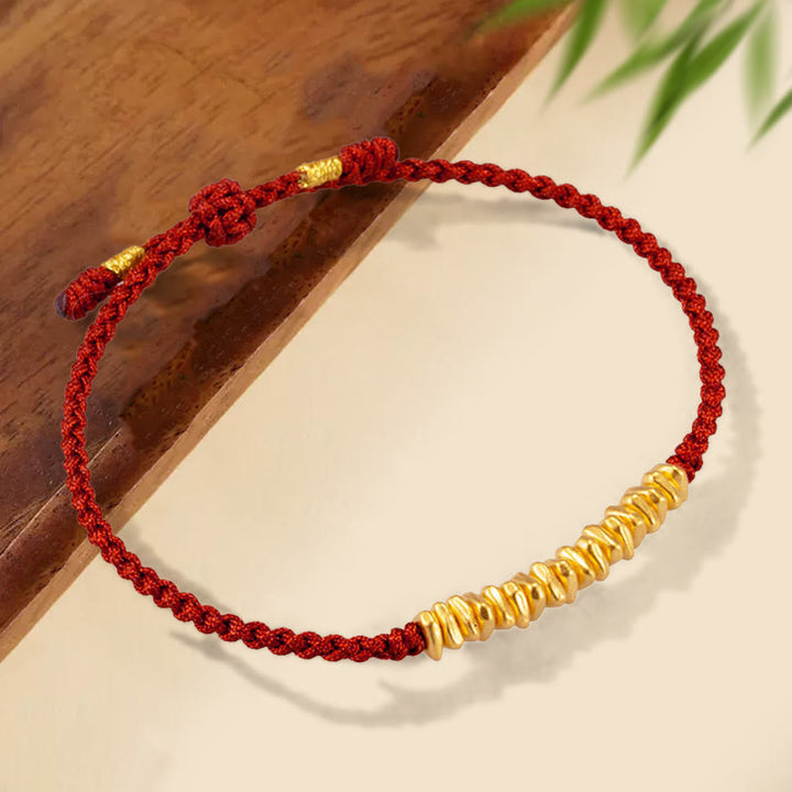 Pulsera trenzada de protección hecha a mano con diseño de pequeñas piezas de oro 999 y Buddha Stones