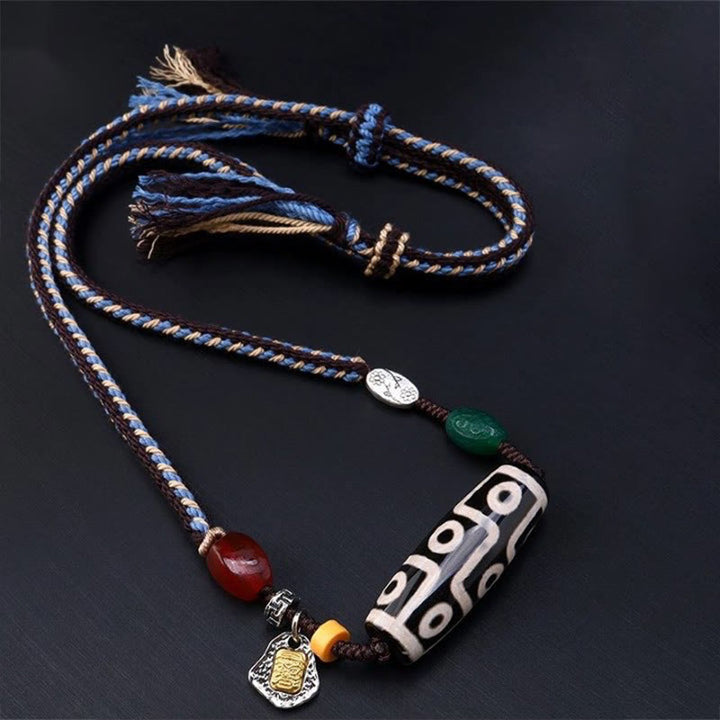 Collar con colgante de cuerda trenzada con protección de cuentas Dzi tibetanas de nueve ojos y Buddha Stones