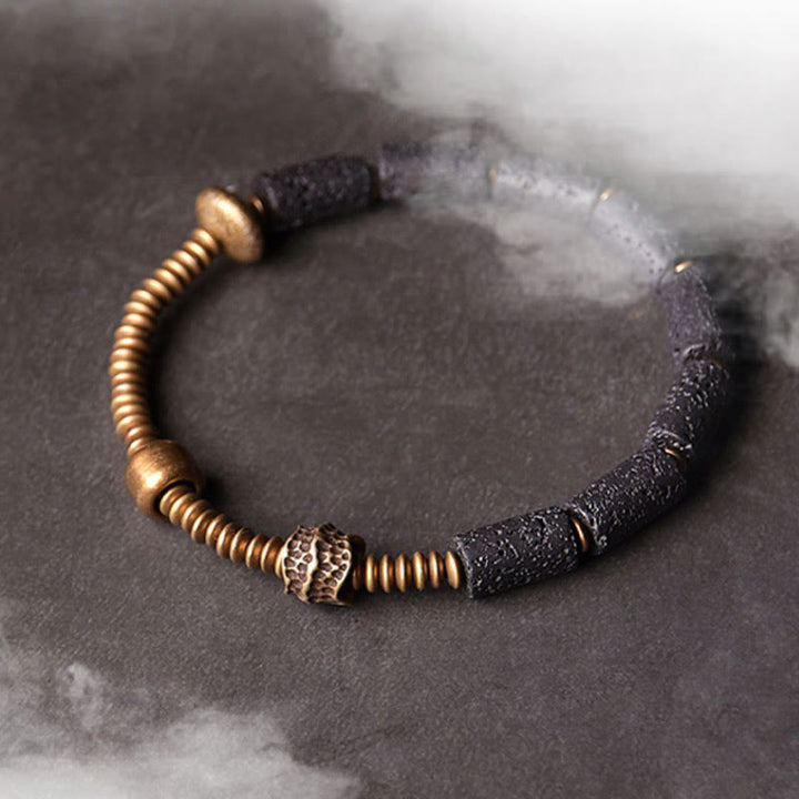 Pulsera de cobre con cuentas de lava negra y Buddha Stones para la suerte y la riqueza