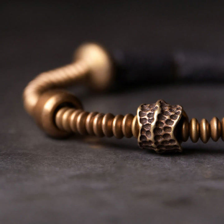 Pulsera de cobre con cuentas de lava negra y Buddha Stones para la suerte y la riqueza