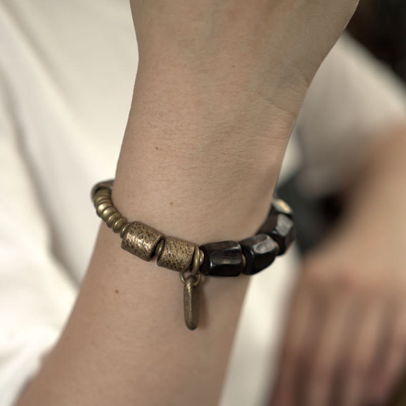 Pulsera de cuentas de cobre y madera de ébano con Buddha Stones y diseño vintage de la paz