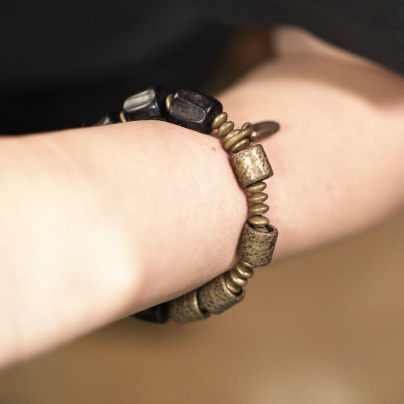Pulsera de cuentas de cobre y madera de ébano con Buddha Stones y diseño vintage de la paz