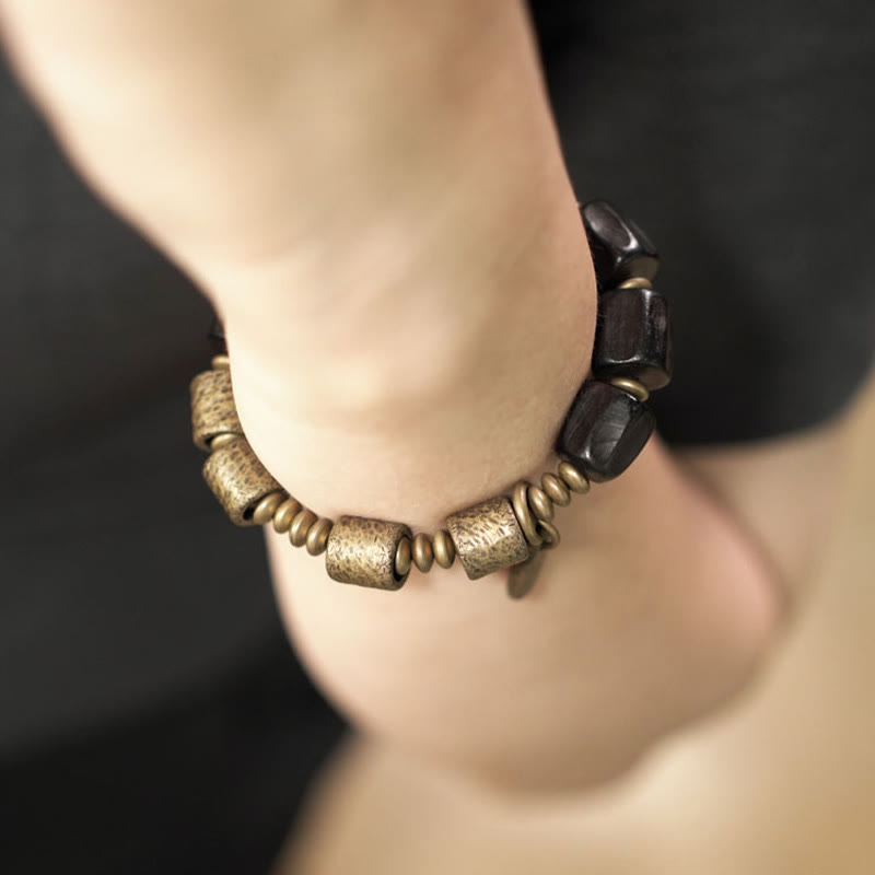 Pulsera de cuentas de cobre y madera de ébano con Buddha Stones y diseño vintage de la paz