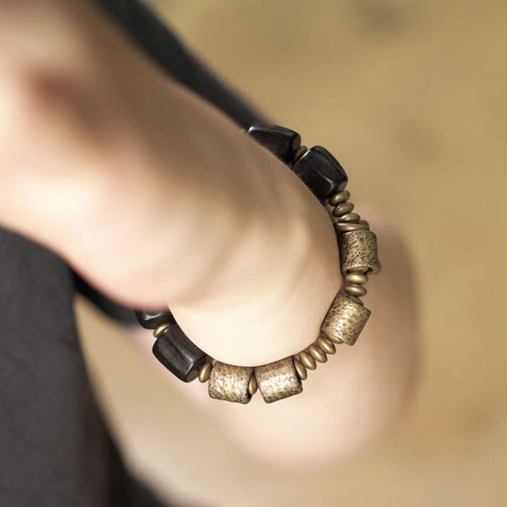 Pulsera de cuentas de cobre y madera de ébano con Buddha Stones y diseño vintage de la paz