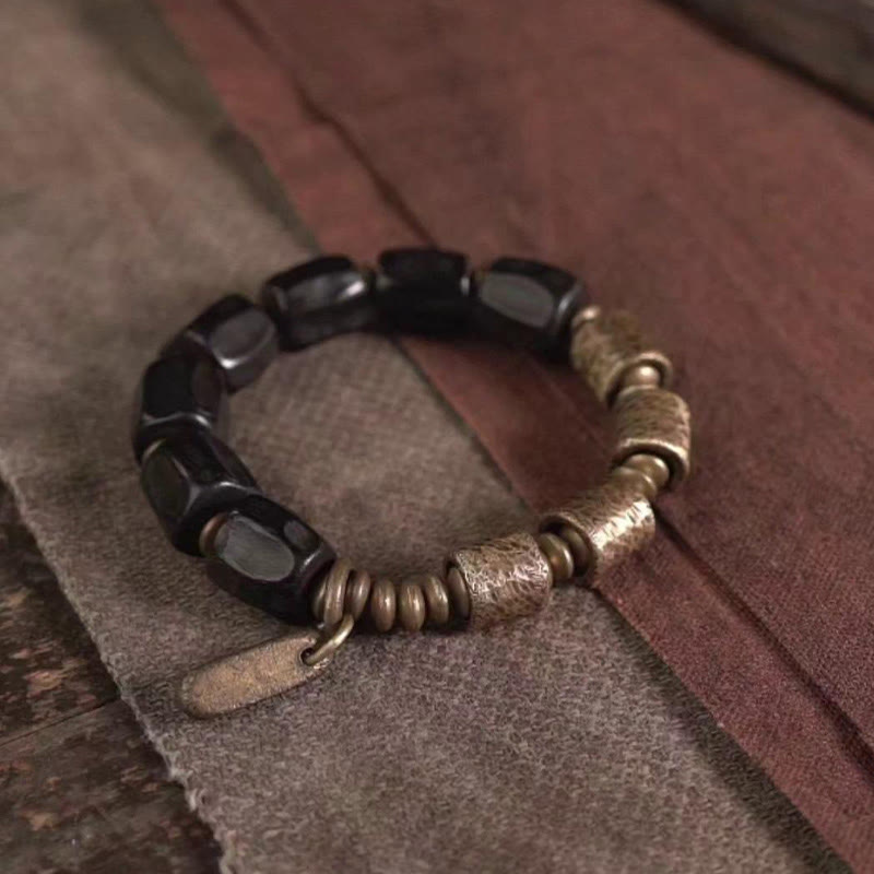 Pulsera de cuentas de cobre y madera de ébano con Buddha Stones y diseño vintage de la paz