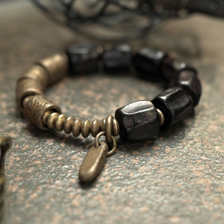 Pulsera de cuentas de cobre y madera de ébano con Buddha Stones y diseño vintage de la paz