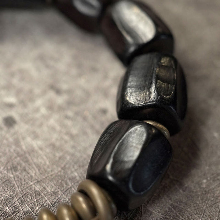 Pulsera de cuentas de cobre y madera de ébano con Buddha Stones y diseño vintage de la paz