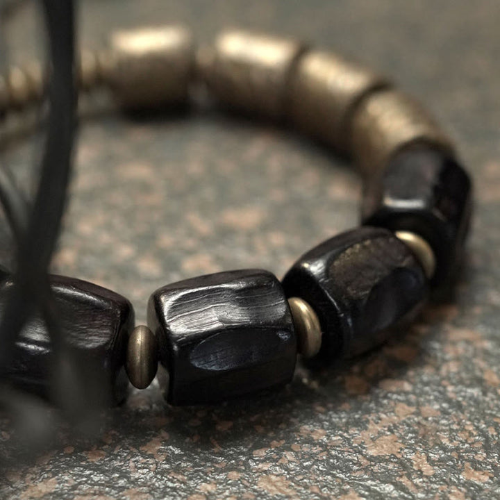 Pulsera de cuentas de cobre y madera de ébano con Buddha Stones y diseño vintage de la paz
