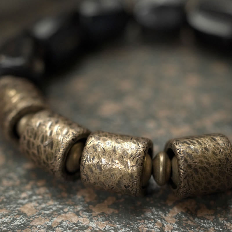 Pulsera de cuentas de cobre y madera de ébano con Buddha Stones y diseño vintage de la paz