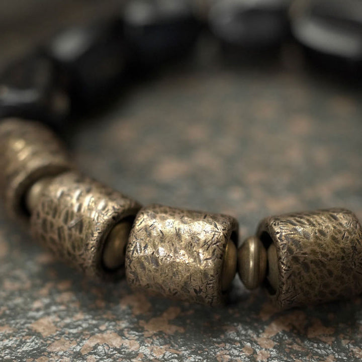 Pulsera de cuentas de cobre y madera de ébano con Buddha Stones y diseño vintage de la paz
