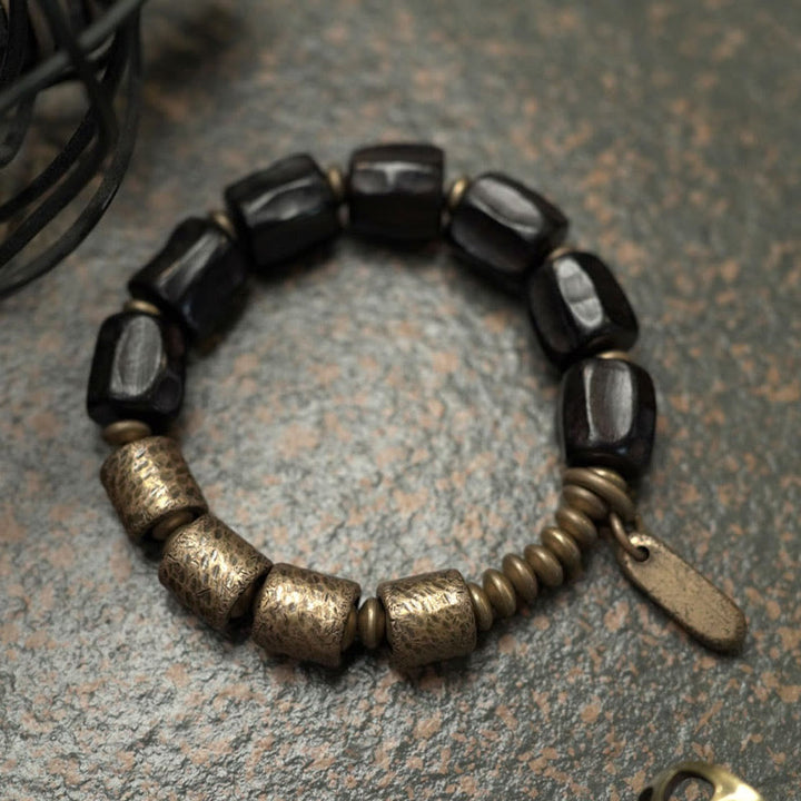 Pulsera de cuentas de cobre y madera de ébano con Buddha Stones y diseño vintage de la paz