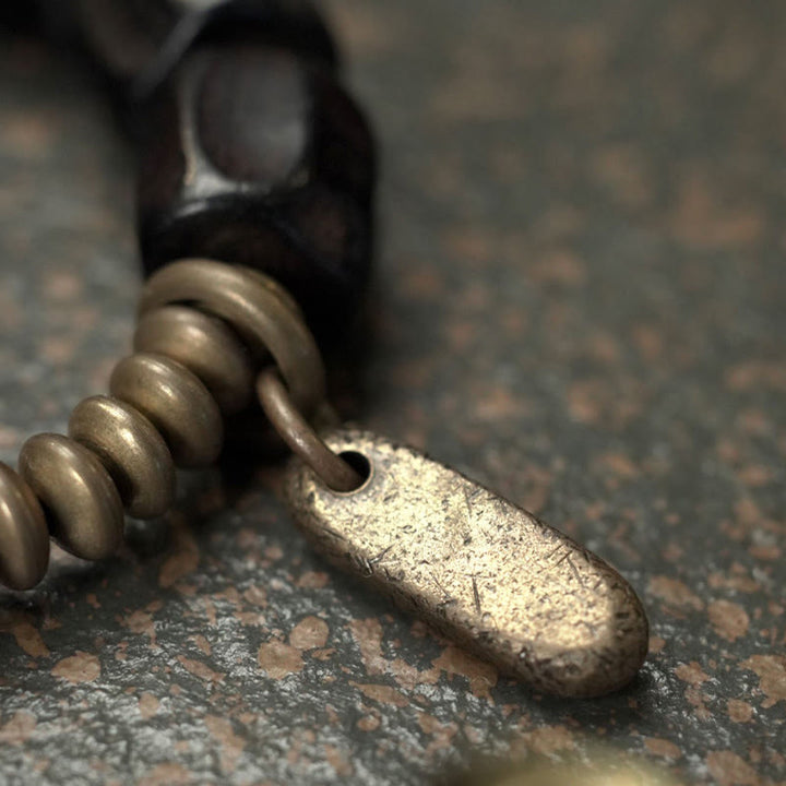 Pulsera de cuentas de cobre y madera de ébano con Buddha Stones y diseño vintage de la paz
