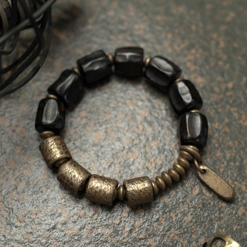 Pulsera de cuentas de cobre y madera de ébano con Buddha Stones y diseño vintage de la paz