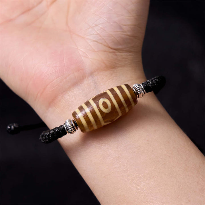 Buddha Stones Pulsera Tibetana con Cuentas Dzi de Nueve Ojos y de Tres Ojos para Protección y Riqueza
