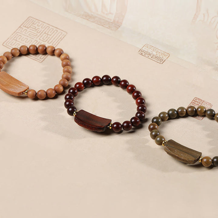 Pulsera de seis palabras verdaderas de la paz con hojas pequeñas de sándalo rojo y sándalo verde y piedras de Buddha Stones