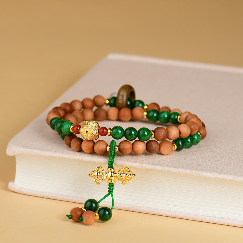 Pulsera de protección y curación con diseño de doble torsión de vajra, dorje tibetano y cuentas de madera de sándalo y Buddha Stones