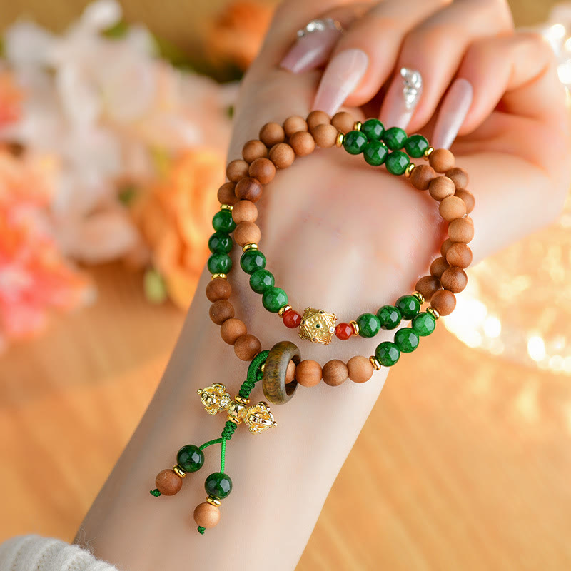 Pulsera de protección y curación con diseño de doble torsión de vajra, dorje tibetano y cuentas de madera de sándalo y Buddha Stones