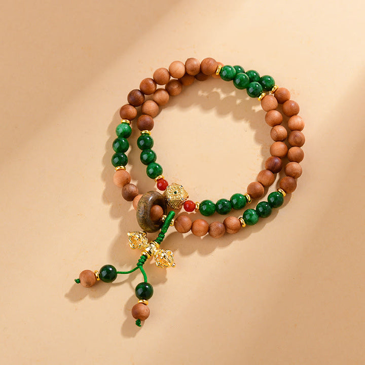 Pulsera de protección y curación con diseño de doble torsión de vajra, dorje tibetano y cuentas de madera de sándalo y Buddha Stones