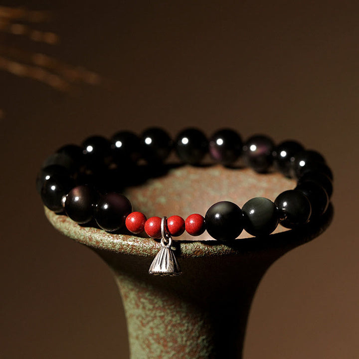Pulsera de fuerza con dije de loto y cinabrio de obsidiana negra natural de Buddha Stones