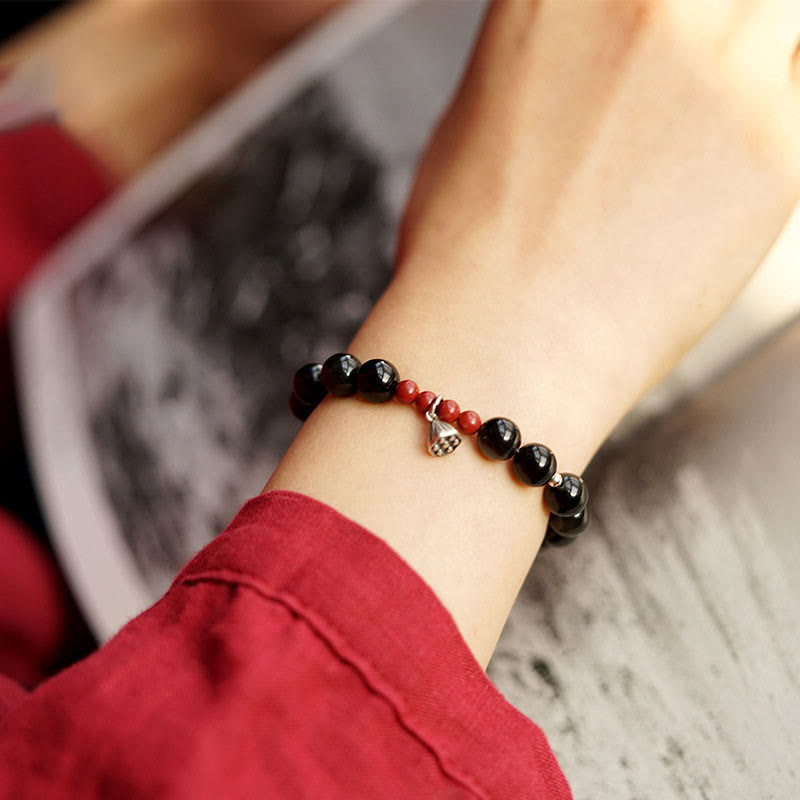 Pulsera de fuerza con dije de loto y cinabrio de obsidiana negra natural de Buddha Stones