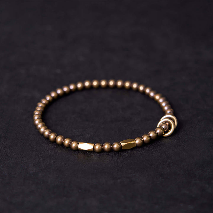 Pulsera de pareja con diseño de cuentas de cobre y latón para el cuidado personal y la riqueza de Buddha Stones - image 1