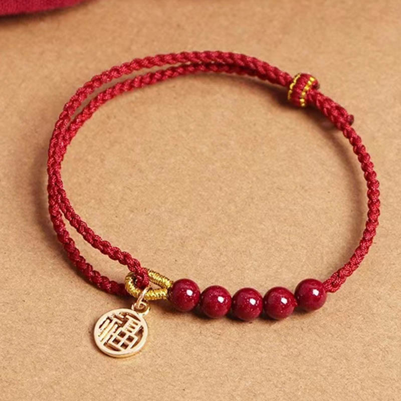 Pulsera trenzada hecha a mano con hilo rojo y bendición de cuentas de cinabrio con caracteres Fu y Buddha Stones