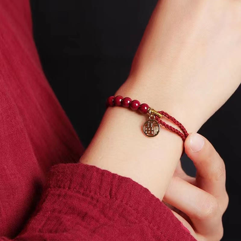 Pulsera trenzada hecha a mano con hilo rojo y bendición de cuentas de cinabrio con caracteres Fu y Buddha Stones