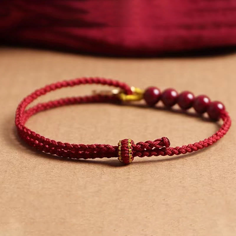 Pulsera trenzada hecha a mano con hilo rojo y bendición de cuentas de cinabrio con caracteres Fu y Buddha Stones