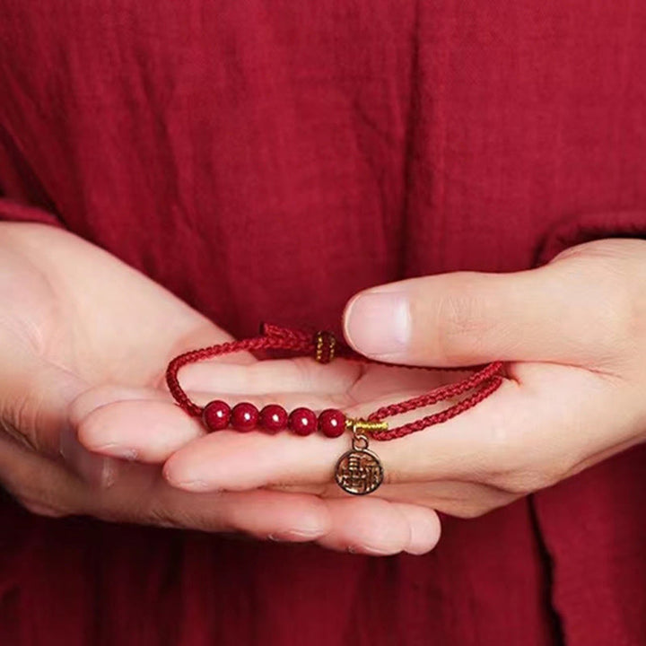 Pulsera trenzada hecha a mano con hilo rojo y bendición de cuentas de cinabrio con caracteres Fu y Buddha Stones