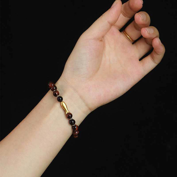 Pulsera de coraje con pez koi y ojo de tigre de Buddha Stones